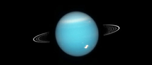 Uran, jak byl pozorován NASA / ESA Hubbleovým vesmírným teleskopem v roce 2005.